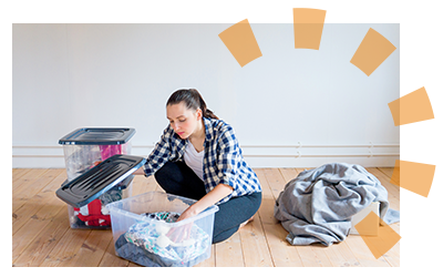 A woman organizing items form her storage unit to keep in her home. 